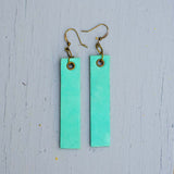 mint colored minimalist rectangular leather earrings front top view