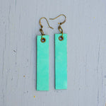 mint colored minimalist rectangular leather earrings front top view