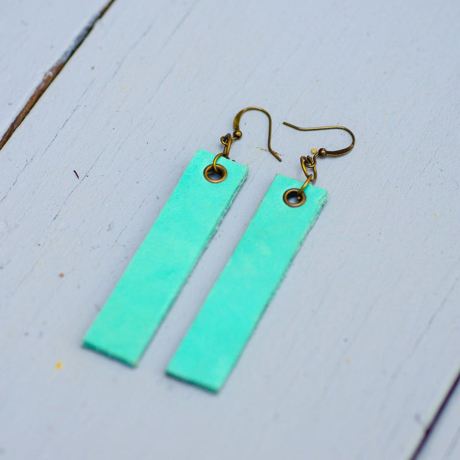 mint colored minimalist rectangular leather earrings with antique hooks, side view
