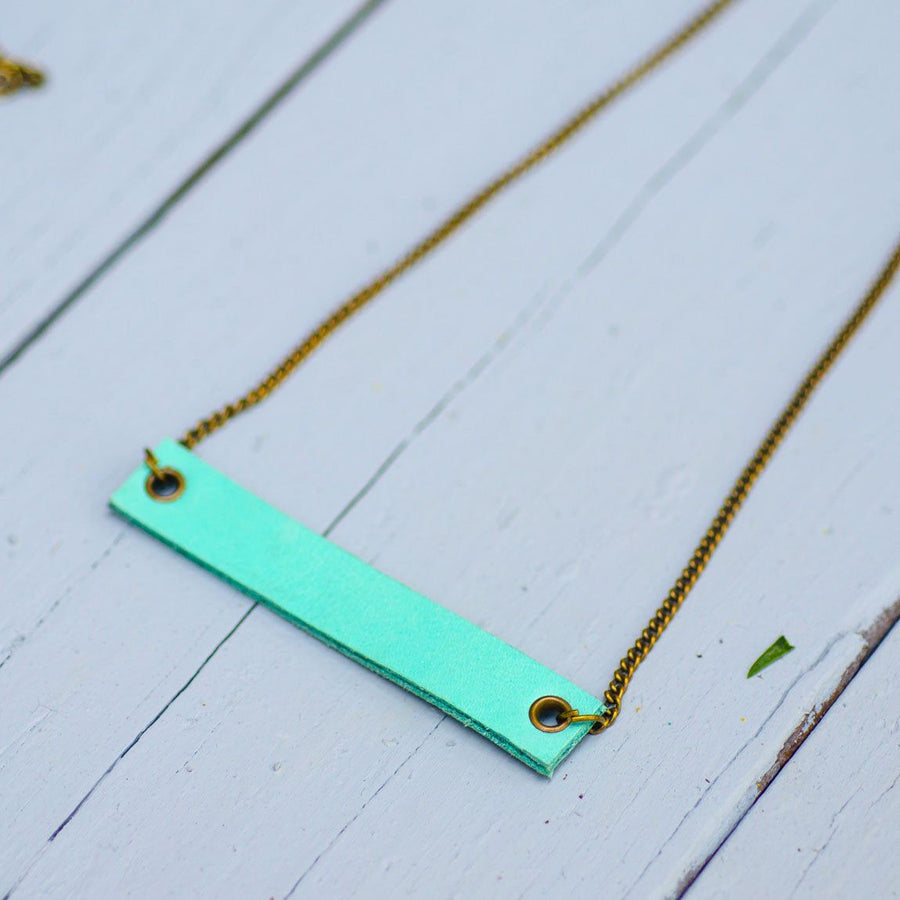 mint colored minimalist rectangular leather neck piece with antique chain