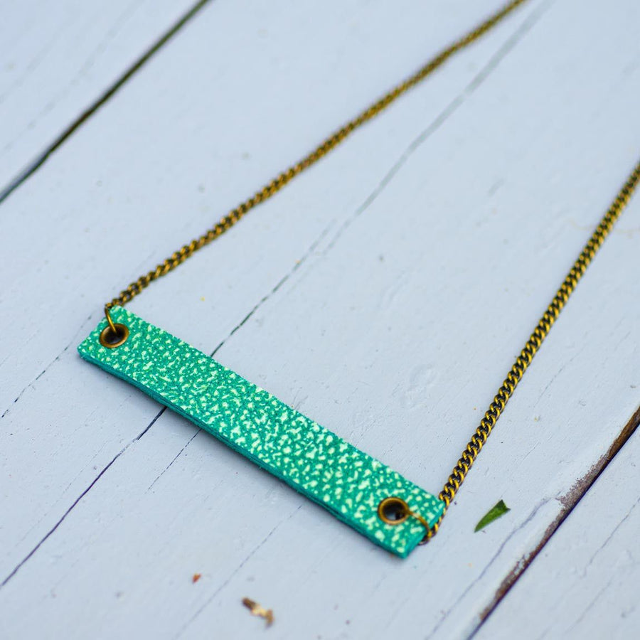 sea green minimalist rectangular textured leather neck piece with antique chain